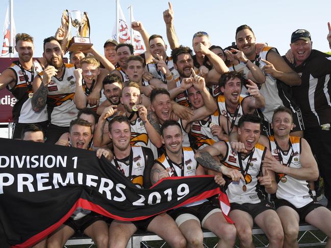 Craigieburn strikes a premiership pose after its grand final triumph. Picture: Andy Brownbill