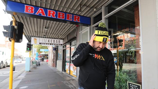 The Front Bar host Mick Molloy looking sheepish after leaving the Dr Follicles barber in Richmond. Picture: Alex Coppel.