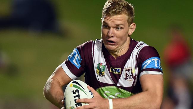 Tom Trbojevic of the Sea Eagles runs the ball up the field during the round 3 NRL match between the Manly Sea Eagles and the Cronulla Sutherland Sharks at Brookvale Oval in Sydney on Monday, March 21, 2016. (AAP Image/Paul Miller) NO ARCHIVING, EDITORIAL USE ONLY