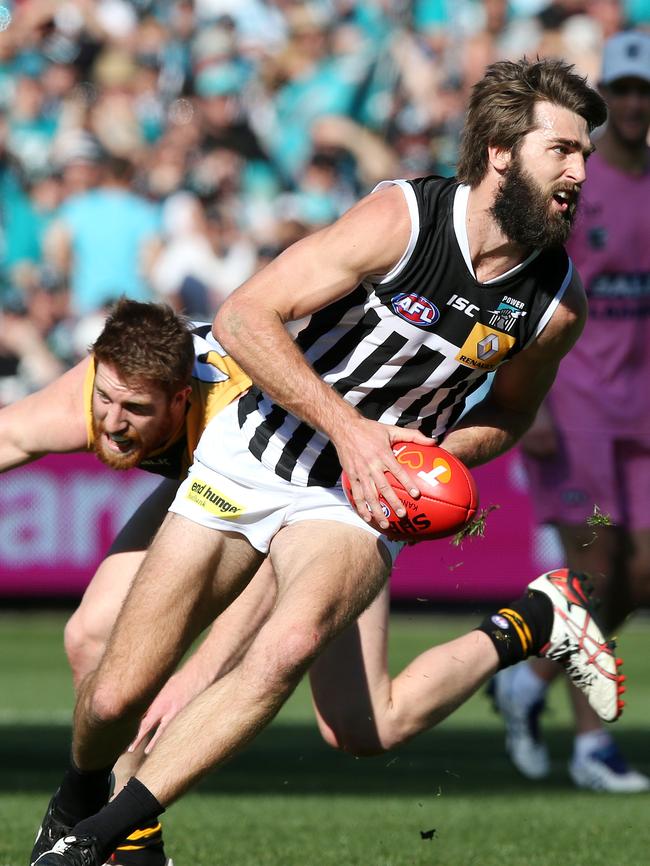 Port Adelaide stormed to victory in the knockout final after Cotchin kicked against the breeze.