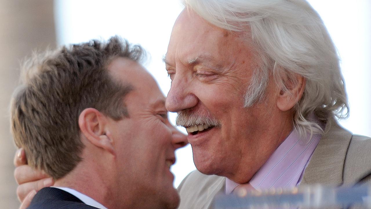 Kiefer Sutherland hugs his father after being honoured with the 2377th Star on the Hollywood Walk of Fame in 2008. Picture: Gabriel BOUYS / AFP