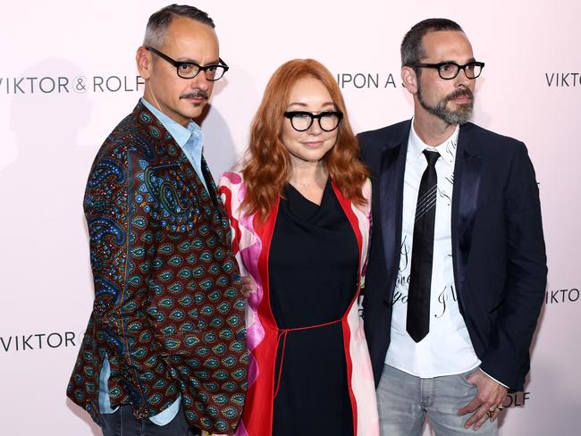 Viktor Horsting, Tori Amos and Rolf Snoeren attend the Viktor &amp; Rolf FlowerBomb fragrance 10th anniversary party in Paris. Picture: AP