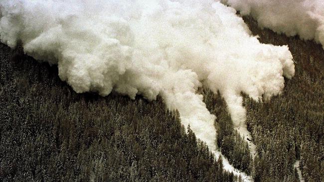 Aerial view as one of two avalanches making its way through the mountainside landscape towards Swiss ski resort of Evolene, Swiss Alps, 22/02/99 killing two people & dozens missing after snow storms hit the Swiss & French Alps today. Switzerland / Weather / Avalanche