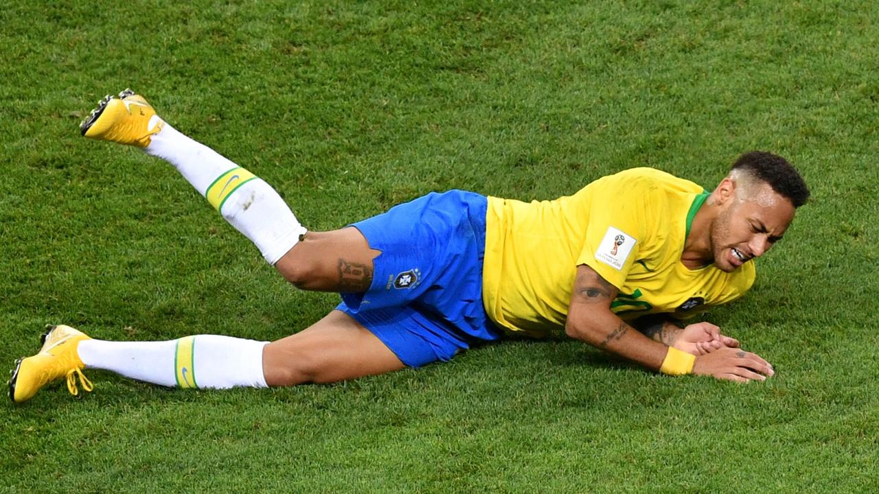 Brazil's forward Neymar falls down during the Russia 2018 World Cup quarter-final.