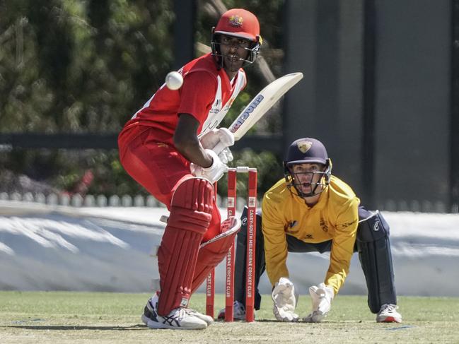 Ashley Chandrasinghe batting for Casey South Melbourne and Kingston Hawthorn keeper Joel Lewis. Picture: Valeriu Campan