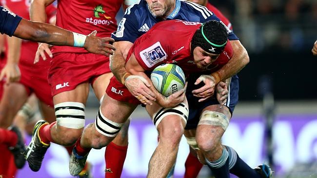 AUCKLAND, NEW ZEALAND - MAY 02: Liam Gill of the Reds is tackled by Tom Donnelly of the Blues during the round 12 Super Rugby match between the Blues and the Reds at Eden Park on May 2, 2014 in Auckland, New Zealand. (Photo by Phil Walter/Getty Images)