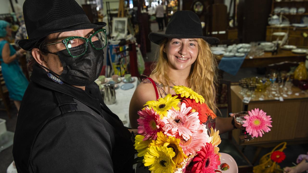 Secret agent Petal of the Secret Flower Service delivers a complimentary flower to Natasha Franklin at the Alice in Arcade Land and Olly and Ronnies vintage fashion pop-up shop high tea at The Vintage Pear, Saturday, February 12, 2022. Picture: Kevin Farmer