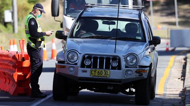 Police at a border checkpoint on Miles St at Coolangatta. Picture: Nigel Hallett