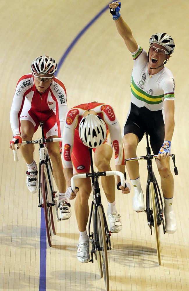 Meyer celebrates after crossing the finish line first during the points race.