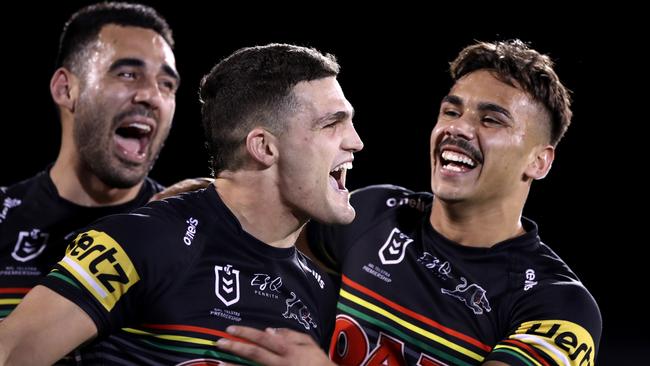 Tyrone May, Nathan Cleary and Daine Laurie of the Panthers celebrate after winning the round 15 NRL match between the Penrith Panthers and the Cronulla Sharks at Panthers Stadium on August 21, 2020. Photo by Mark Kolbe/Getty Images