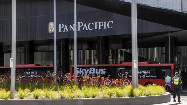 Returned travellers arrive in a SkyBus at the Pan Pacific Hotel in South Wharf. Picture: Ian Currie