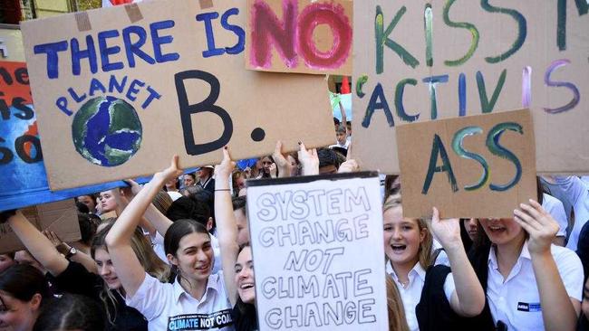 Students’ abuisive signs say it all. Picture: AAP/Dan Himbrechts