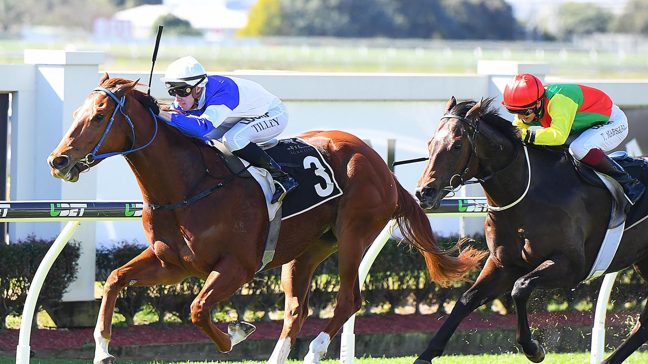 Jockey Les Tilley rides Spurcraft to victory at Doomben last season. Picture AAP Image/Albert Perez.