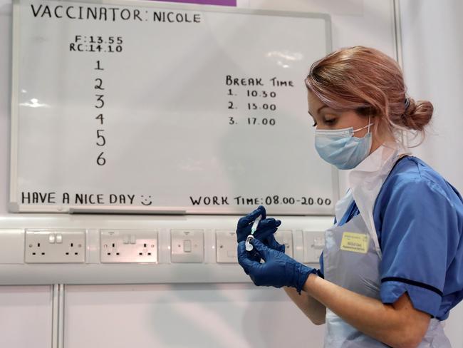 Vaccinator Nicole Clark prepares a COVID-19 vaccination at a Glasgow hospital. Picture: Getty Images