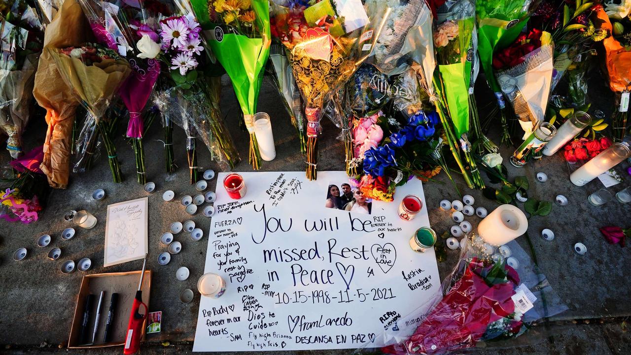 Letters, candles and flowers are seen outside Astroworld after eight died in a crowd surge. Picture: Getty Images/AFP.