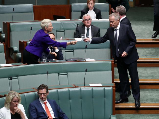 Dr Kerry Phelps receives a document from Opposition Leader Bill Shorten which she signed and returned on Tuesday. Picture: Gary Ramage