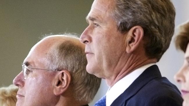 Under strict embargo until Jan 1, 2024 - as provided by the National Archives of Australia. Prime Minister John Howard and Janette Howard with US President George W Bushand Laura Bush during an official visit to Canberra, October 2003.