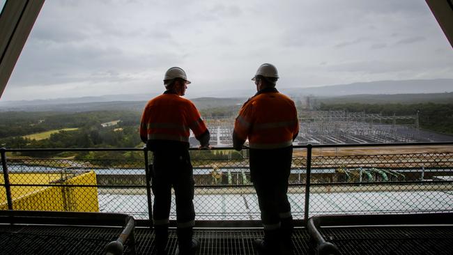 Antony Comic and Tony Phillips look over the switch yard at the Eraring power station at Lake Macquarie. Picture: Liam Driver