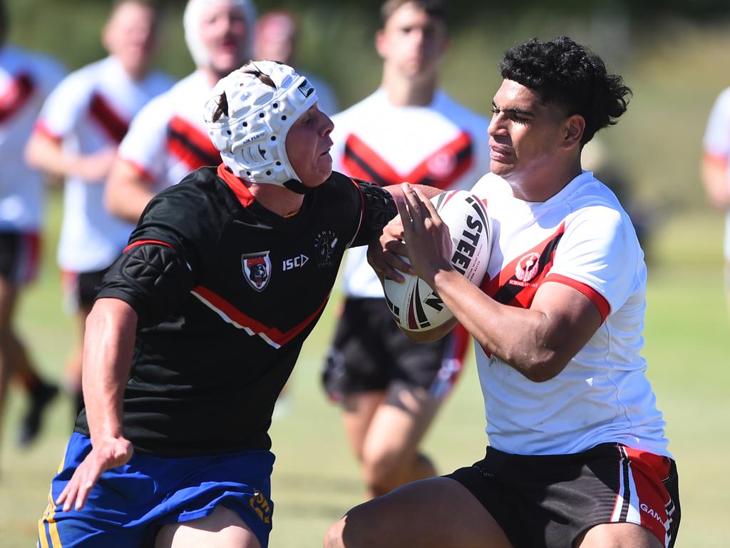 Boys Rugby League State Championship held at Northern Division, Brothers Leagues ground, Townsville. South West (black) v Wide Bay (white). 16-18 years. Noah Law of Shalom College.