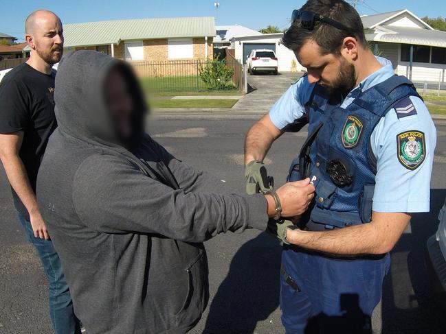 Detectives from Tuggerah Lakes Police District make an arrest on Thursday as part of Strike Force Lamprey.