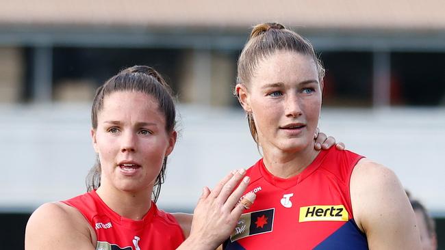 MELBOURNE, AUSTRALIA – NOVEMBER 12: Kate Hore (left) and Tayla Harris of the Demons look dejected after a loss during the 2023 AFLW Second Qualifying Final match between The Melbourne Demons and The North Melbourne Tasmanian Kangaroos at IKON Park on November 12, 2023 in Melbourne, Australia. (Photo by Michael Willson/AFL Photos via Getty Images)