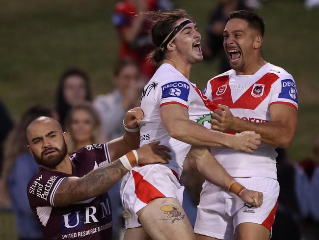 Cody Ramsey of the Dragons celebrates with Corey Norman after scoring a try, which was then disallowed by the video referee. Picture: Mark Kolbe/Getty Images