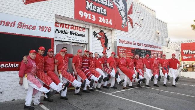 We won. The workforce at Devitt Wholesale Meats at Narrabeen, kicking up its heels. Picture: Supplied