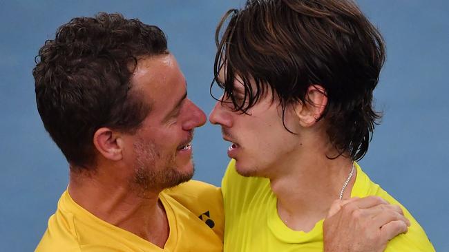 Australia Davis Cup captain Lleyton Hewitt congratulates Alex de Minaur on his tie-saving win over Marton Fucsovics. Picture: AFP