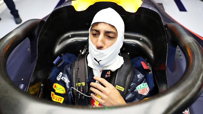 Daniel Ricciardo sits in his car with the halo attached.