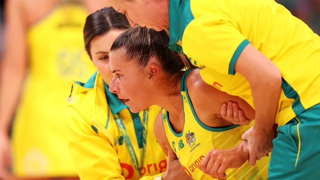 Maddy Proud helped to her feet after a head knock. Picture: Getty