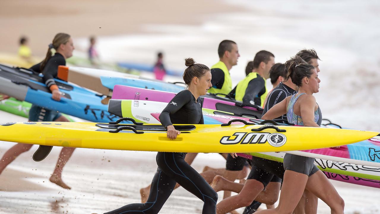 MANLY DAILY/AAP. Ironwoman Lizzie Welborn (middle) during a training session on Newport Beach at Newport on Tuesday, 8 October, 2019. She is competing in the Coolangatta Gold this coming weekend. (AAP IMAGE / Troy Snook)