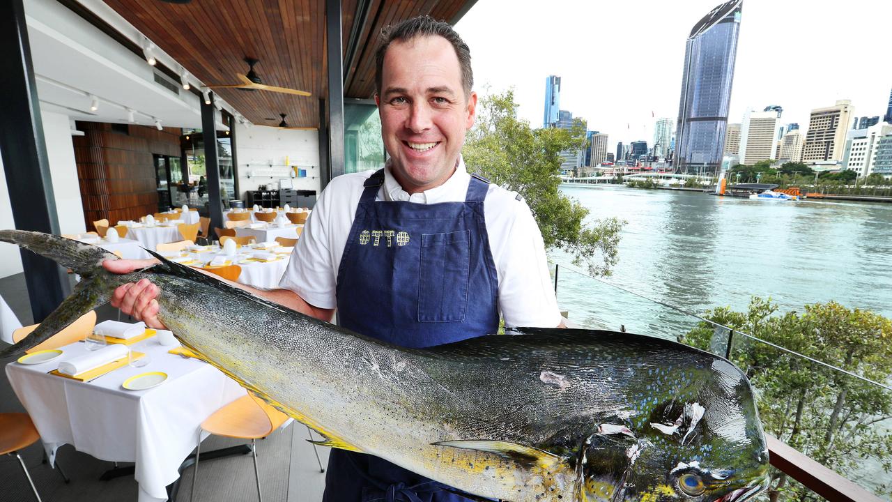 Head chef Will Cowper with a whole Mahi-mahi at Otto Brisbane's new location in South Bank. Picture: Liam Kidston.