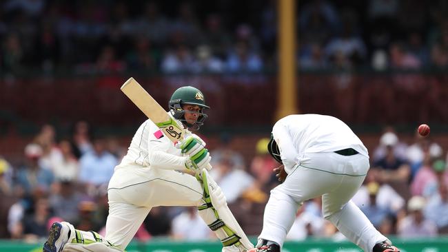 Australia's Usman Khawaja sweeping. Picture: Brett Costello