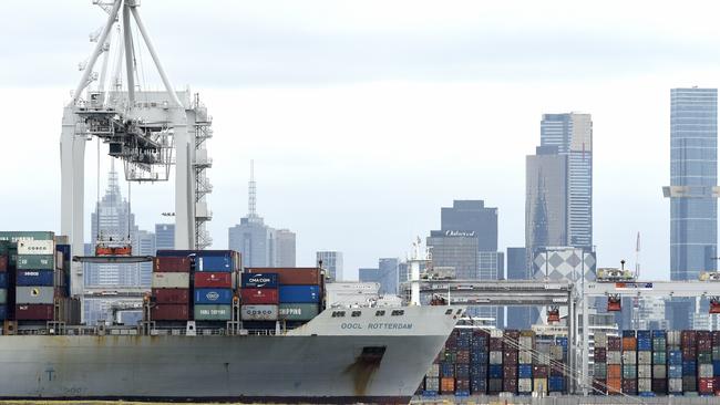 Cargo ships being loaded at the Port of Melbourne. The federal government is examining the possibility of a “strategic fleet” of 12 Australian-flagged merchant ships. Picture: NCA NewsWire/Andrew Henshaw