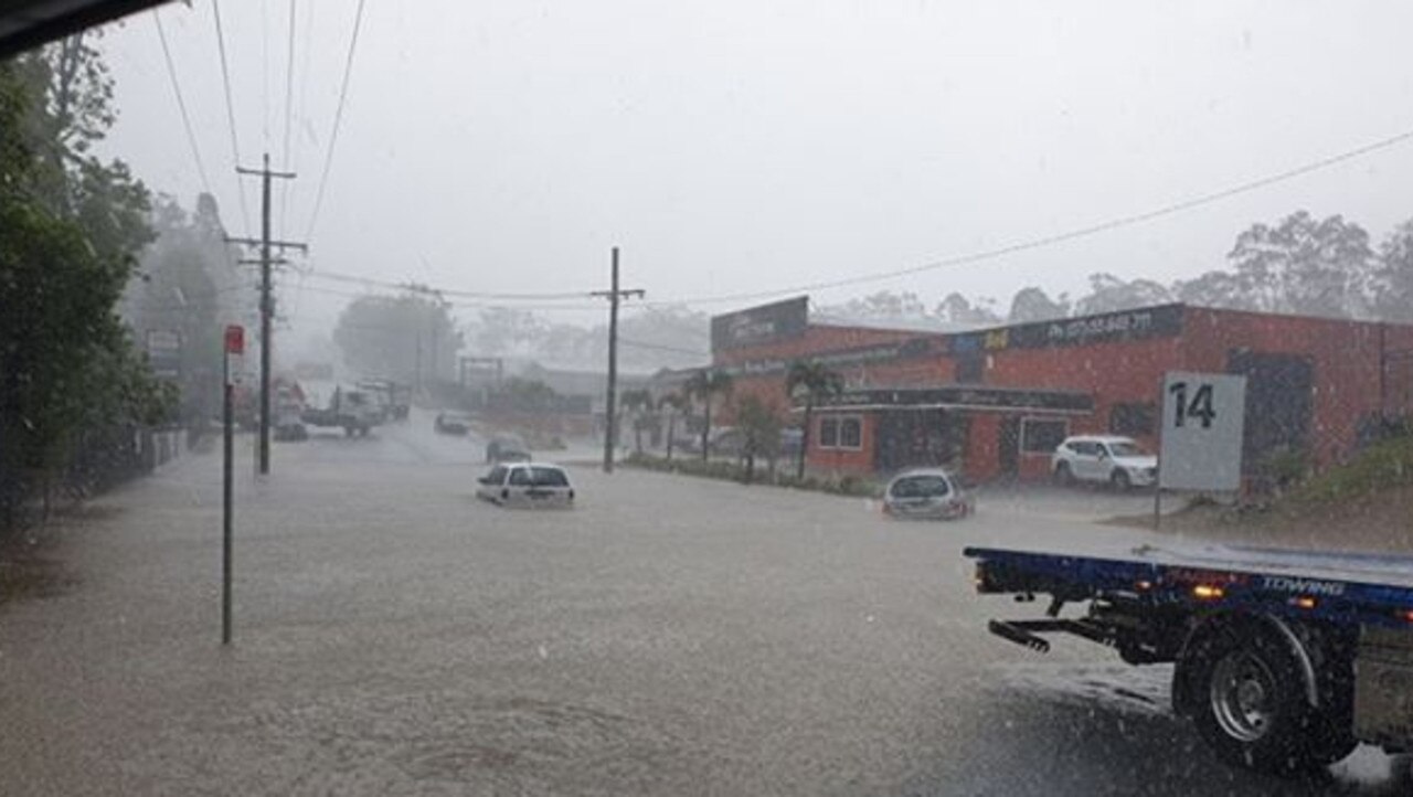 A car underwater at Molendinar. Photo: Sylvia Dc