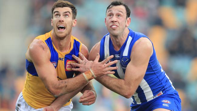 Scott Lycett battles Todd Goldstein at a ruck contest.