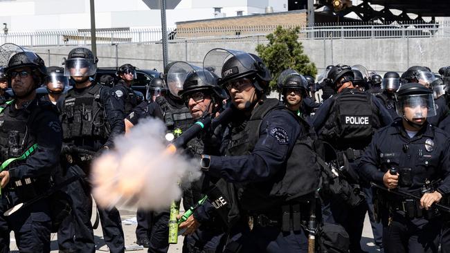 Police conduct non-lethal fire at protesters during clashes outside the federal building in Los Angeles. Picture: AFP