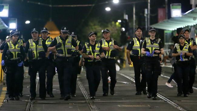 Police on the corner Flinders St and Swanston St on New Year’s Eve. Picture: Yuri Kouzmin