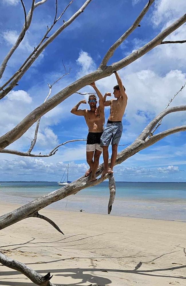 Simon Hayes and his son showing off their guns at the beach. Photo: contributed