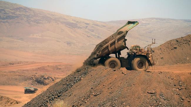 A haul truck dumps a load of rock in the mine pit at Rio Tinto Group's Gudai-Darri iron ore mine in the Pilbara region of Western Australia. Picture: Carla Gottgens/Bloomberg