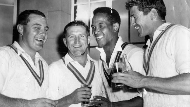 Jubilant SA cricketers celebrate their Sheffield Shield win over Victoria in the dressing room at Adelaide Oval, 24 Feb 1964. (L-r) Wicketkeeper Barry Jarman, captain Les Favell, West Indies all-rounder Garry Sobers and Test bowler Neil Hawke.