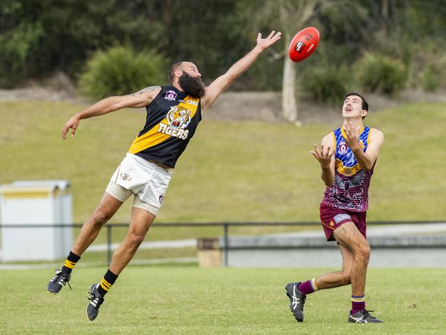 Redcliffe Tigers player Aaron Richardson and Moreton Bay Lions Will Merrilees in the AFL game between Moreton Bay and Redcliffe. Picture: Richard Walker/RDW Photography