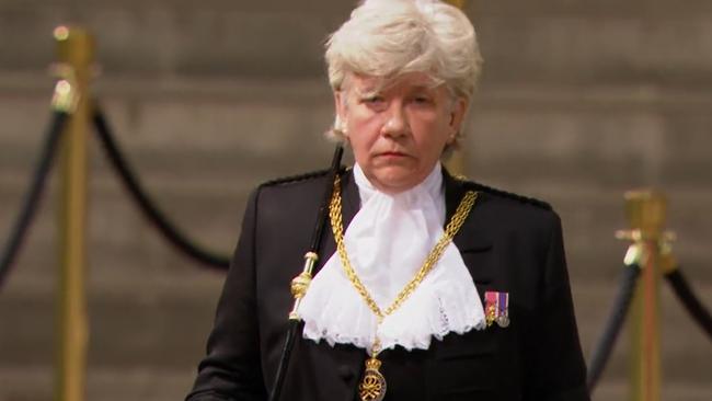 Ms Clarke looked visibly emotional as she walked away from the Queen’s coffin. Picture: BBC