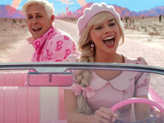 Ryan Gosling as Ken and Margot Robbie as Barbie in a scene from the movie Barbie.