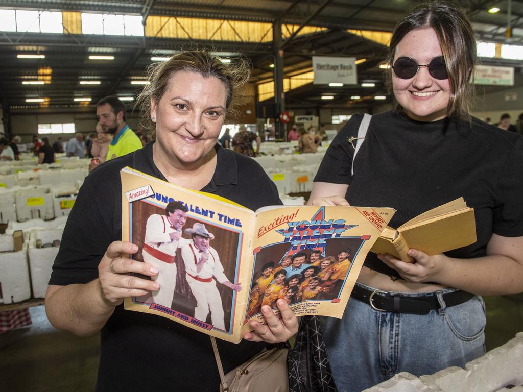 Amy Howarth and Bailee Howarth found a Young Talent Time book at the Chronicle Lifeline Bookfest 2022. Saturday, March 5, 2022. Picture: Nev Madsen.