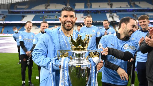 Sergio Aguero of Manchester City celebrates with the Premier League Trophy in 2021. Photo by Michael Regan/Getty Images.