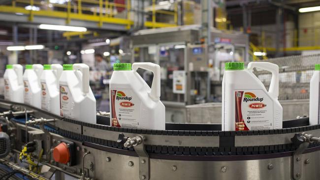 Bottles of roundup brand weedkiller move on a production line at a facility in Belgium. PHOTO: JASPER JUINEN/BLOOMBERG NEWS