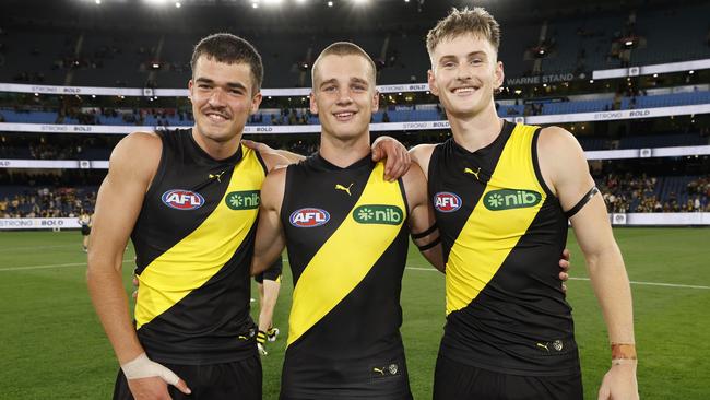 Harry Armstrong (left), Lalor and Luke Trainor beam after their AFL debuts. Photo: Michael Klein