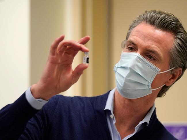 California Governor Gavin Newsom holds up a vial of the Pfizer-BioNTech vaccine. Picture: AFP