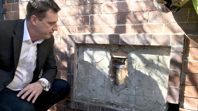 Northern Beaches Mayor Michael Regan looking at the time capsule before it was removed